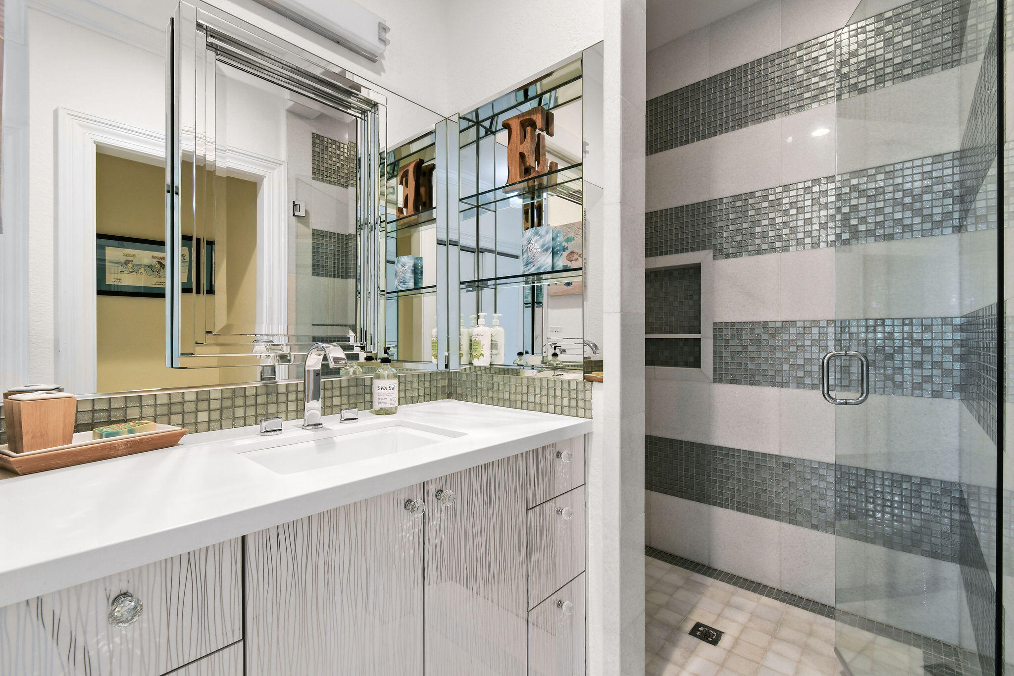 136 Via Catalunha Jupiter, FL 33458 - Photo 42 of 64 a bathroom with a sink and a mirror