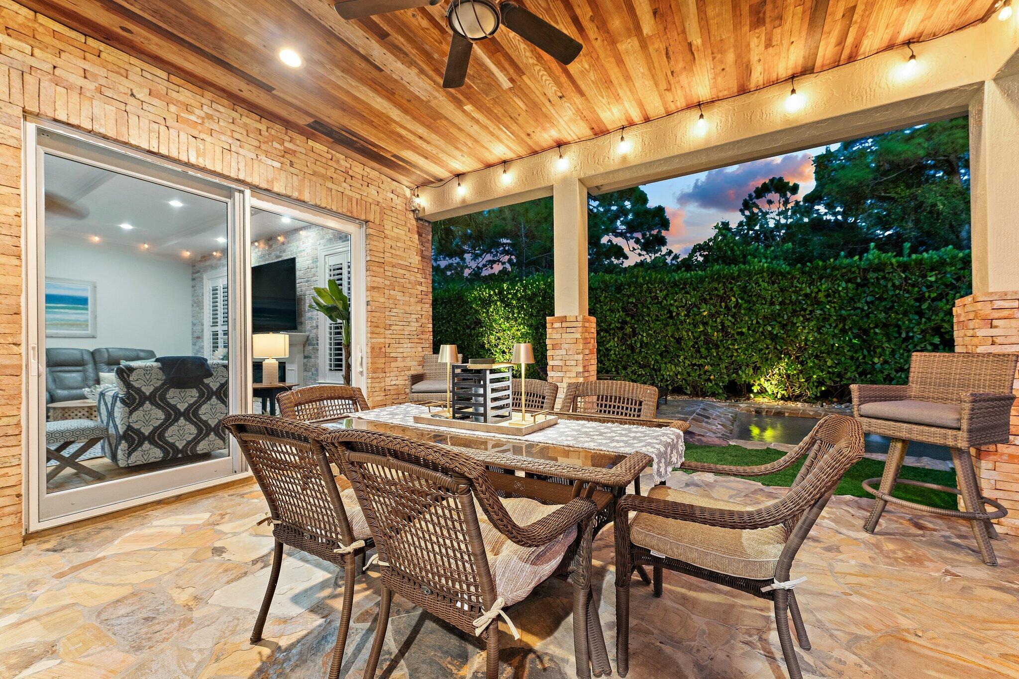 136 Via Catalunha Jupiter, FL 33458 - Photo 48 of 64 a view of an outside dining space with furniture