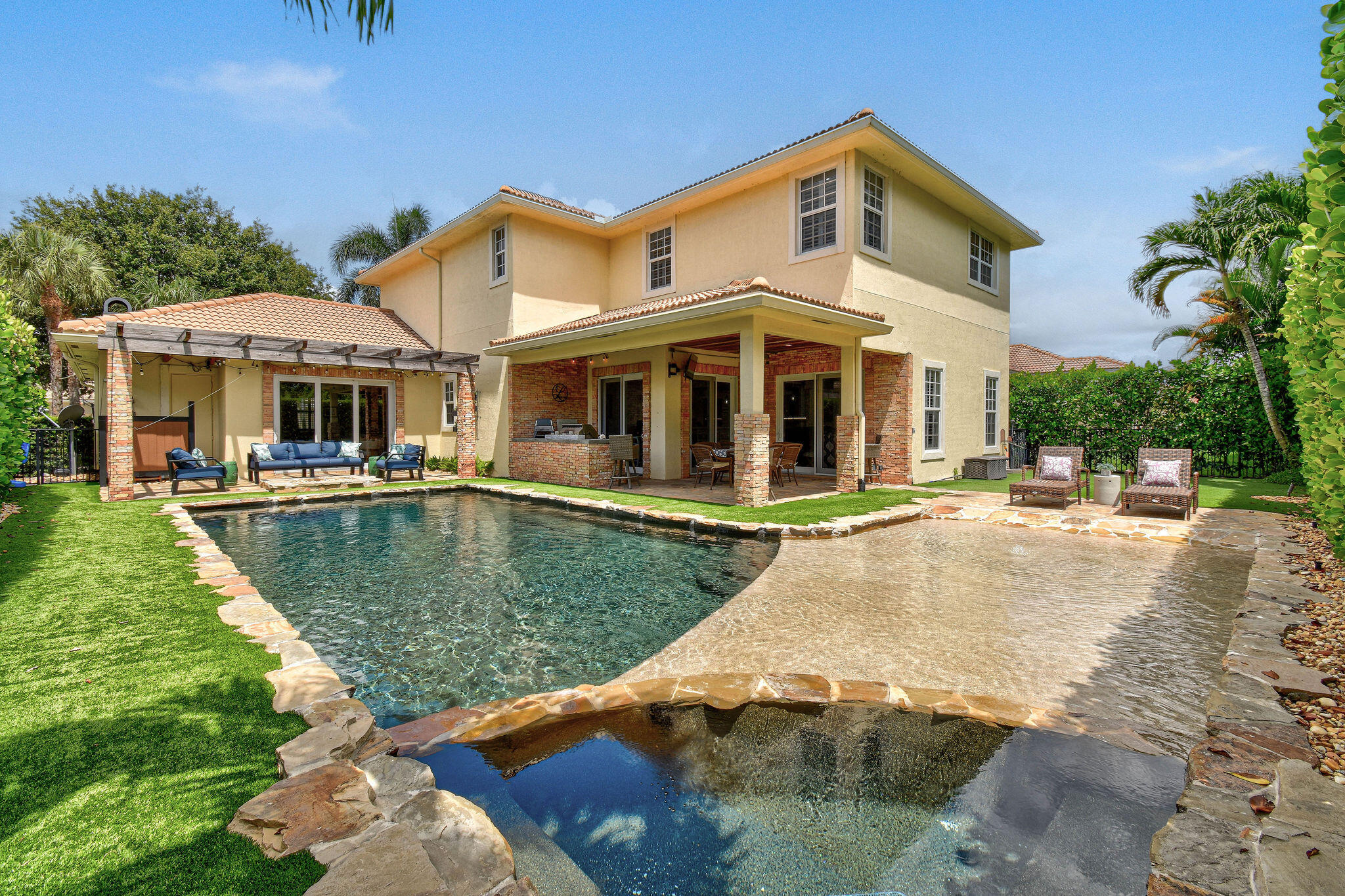 136 Via Catalunha Jupiter, FL 33458 - Photo 51 of 64 a front view of a house with swimming pool