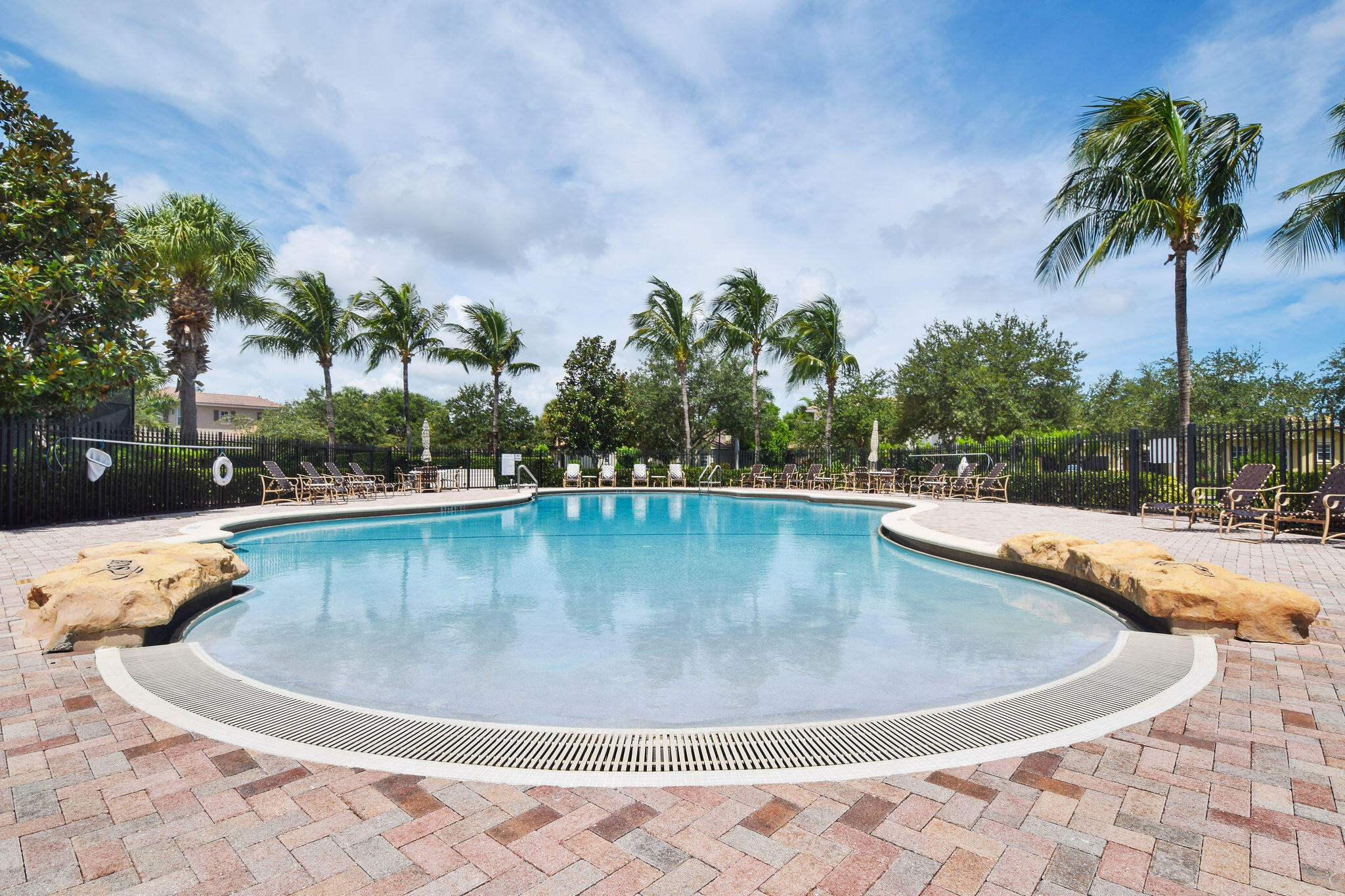 136 Via Catalunha Jupiter, FL 33458 - Photo 58 of 64 a view of a swimming pool with a yard