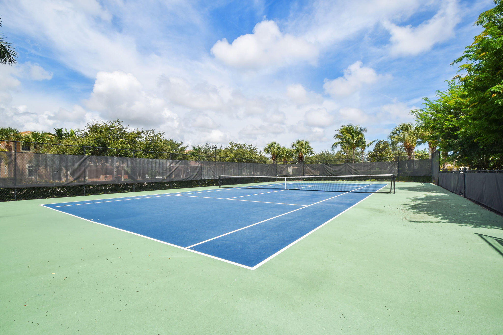 136 Via Catalunha Jupiter, FL 33458 - Photo 60 of 64 a view of a tennis court