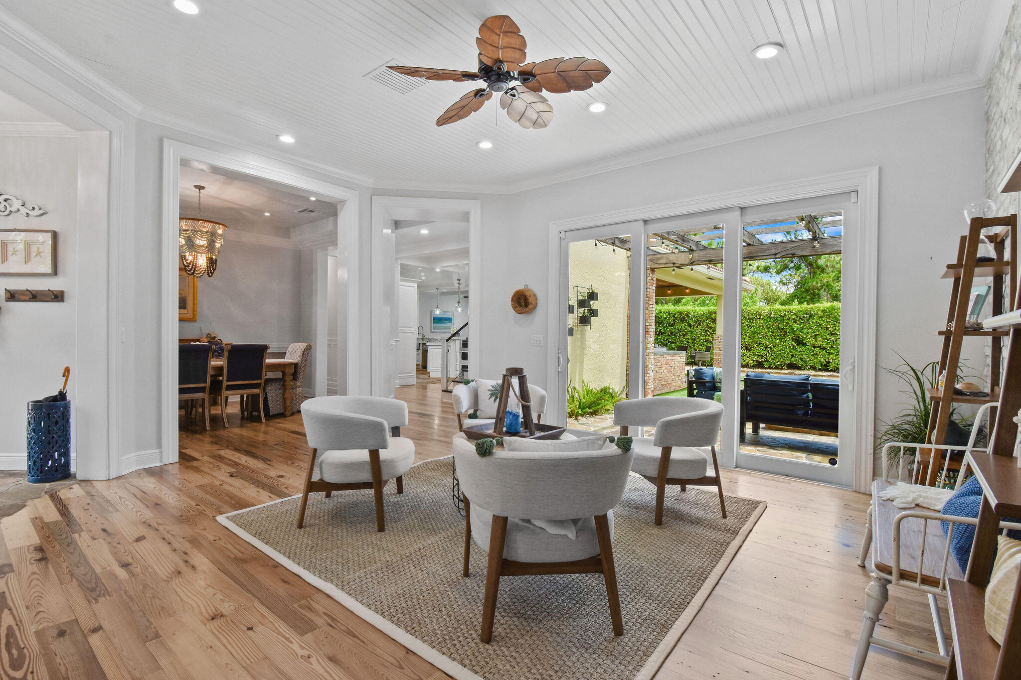 136 Via Catalunha Jupiter, FL 33458 - Photo 9 of 64 a living room with furniture a large window and a chandelier