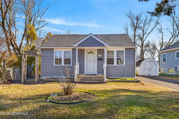 a kitchen with stainless steel appliances granite countertop a stove a sink dishwasher and cabinets with wooden floor