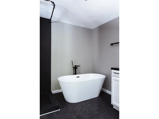 a white room with a sink