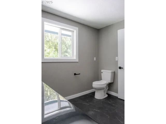 a bathroom with a toilet