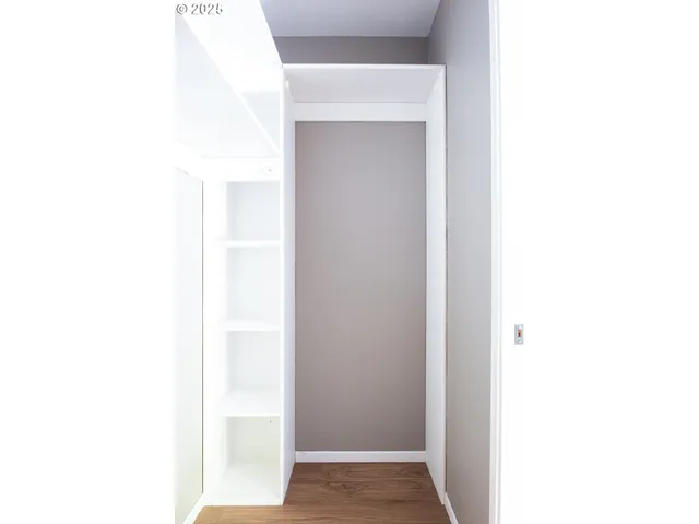 a hallway with cabinet