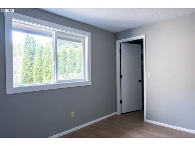 a view of an empty room with a window