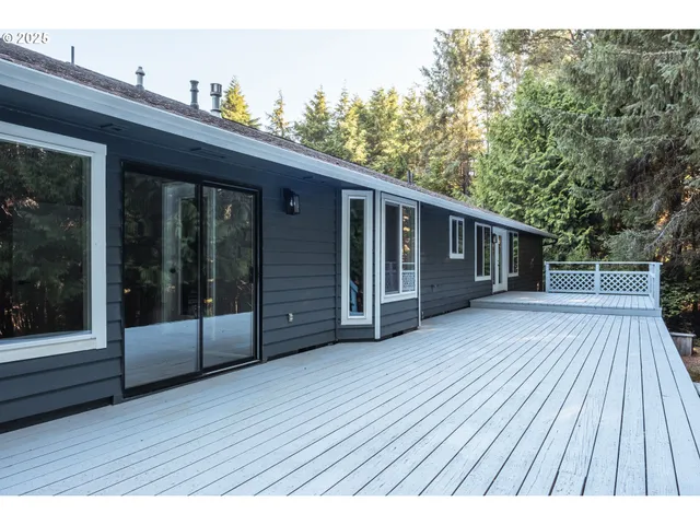 a view of outdoor space with deck and yard