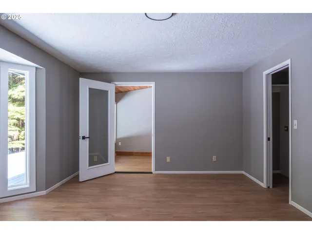 a view of an empty room and window