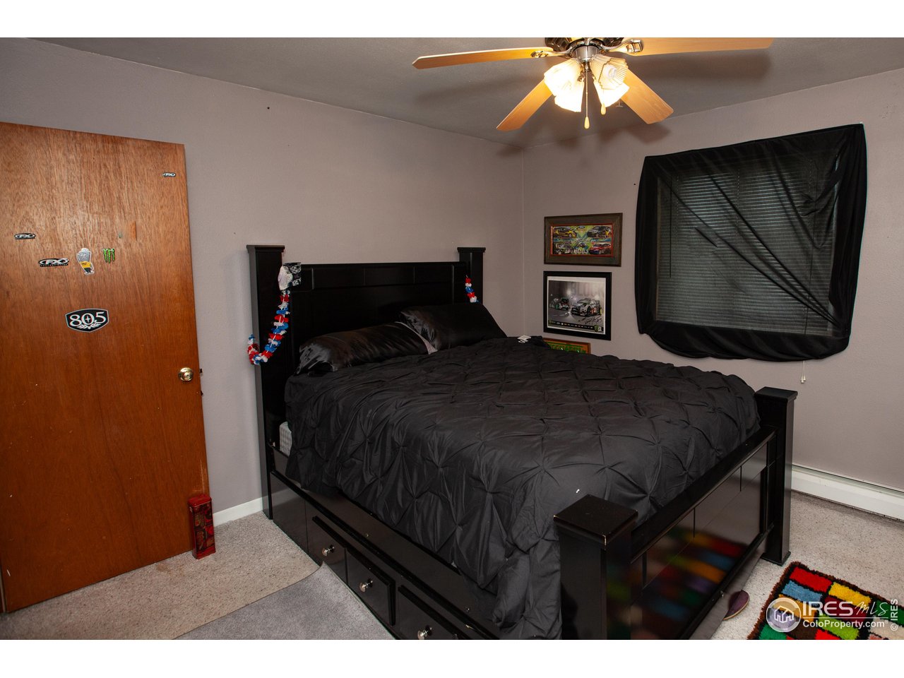 538 California Street Sterling, CO 80751 - Photo 16 of 33 a bedroom with a bed and a painting on the wall