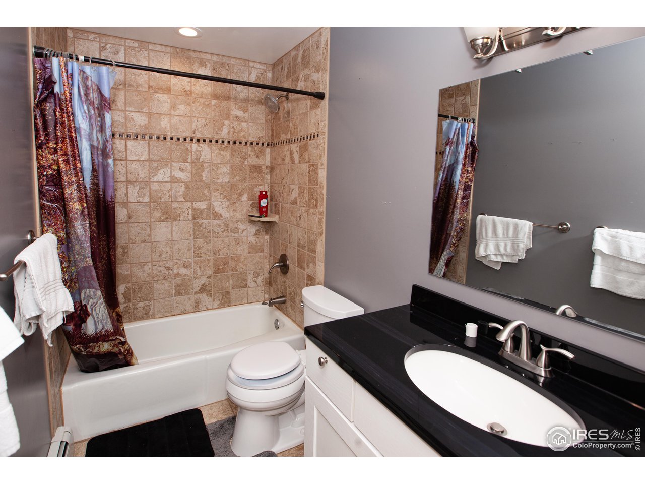 538 California Street Sterling, CO 80751 - Photo 17 of 33 a bathroom with a sink a toilet and a bathtub