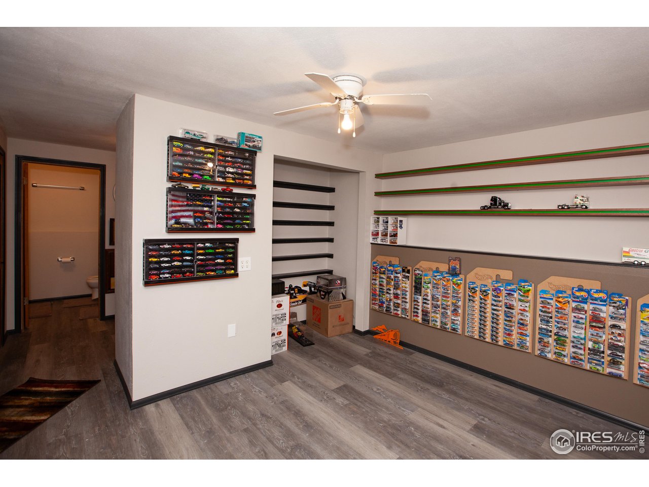 538 California Street Sterling, CO 80751 - Photo 23 of 33 a view of hallway with wooden floor and ceiling fan