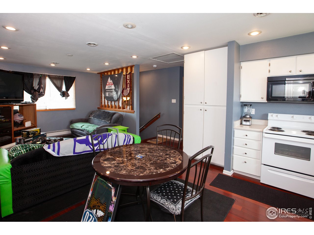 538 California Street Sterling, CO 80751 - Photo 9 of 33 a kitchen with stainless steel appliances kitchen island granite countertop a sink and cabinets