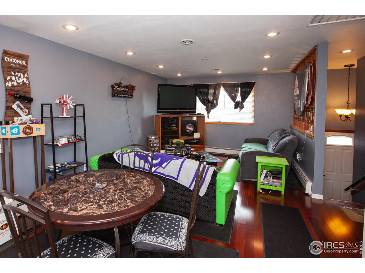 538 California Street Sterling, CO 80751 - Photo 10 of 33 a living room with furniture and a wooden floor