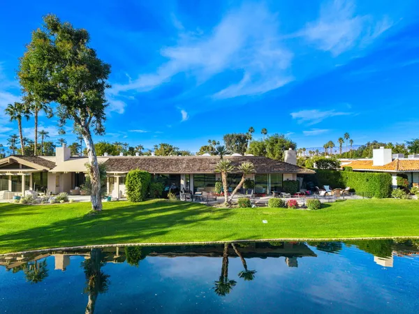 a view of a house with a big yard