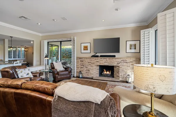 a living room with furniture and a fireplace