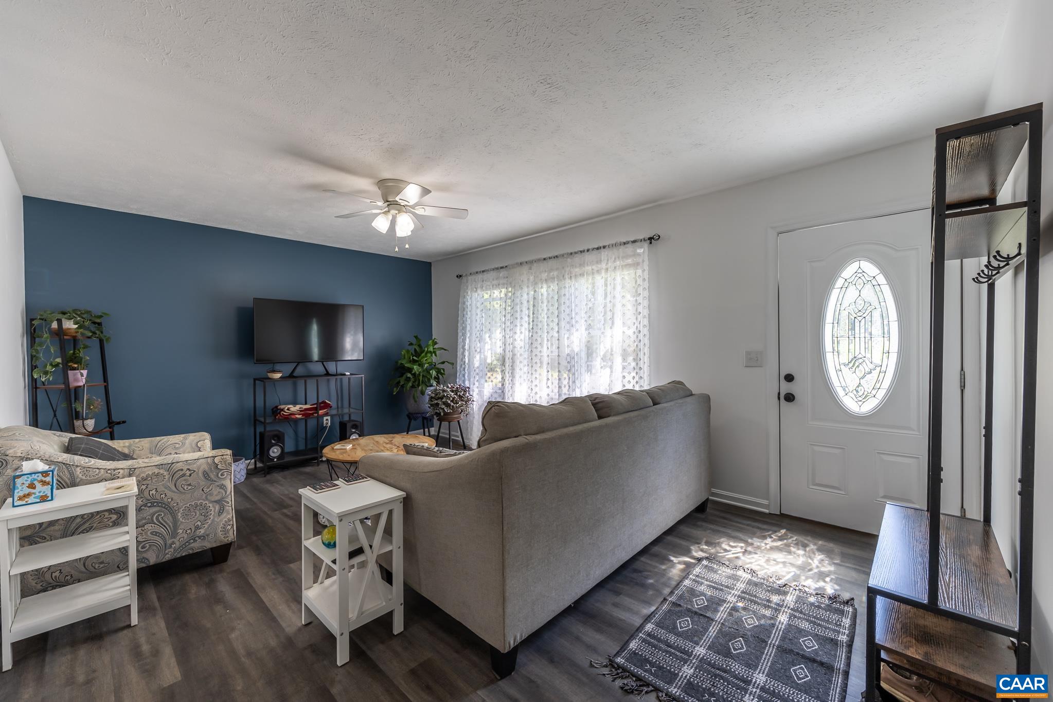 100 Holmes Run Road Stanardsville, VA 22973 - Photo 7 of 22 a living room with furniture and a window