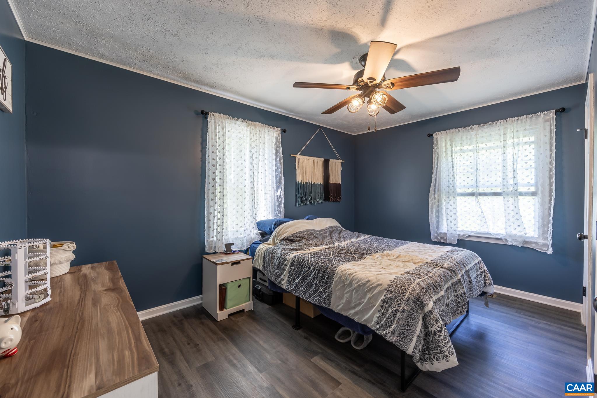 100 Holmes Run Road Stanardsville, VA 22973 - Photo 8 of 22 a bedroom with a bed and a window