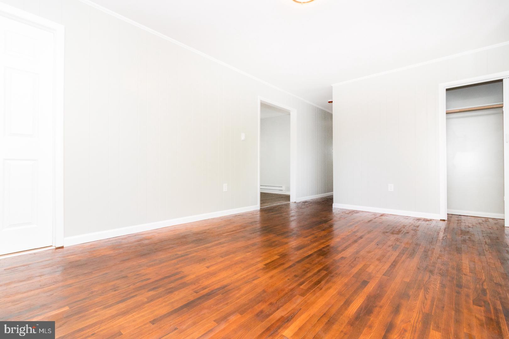 320 Fenwick Road Pilesgrove, NJ 08098 - Photo 2 of 18 a view of a room with wooden floor