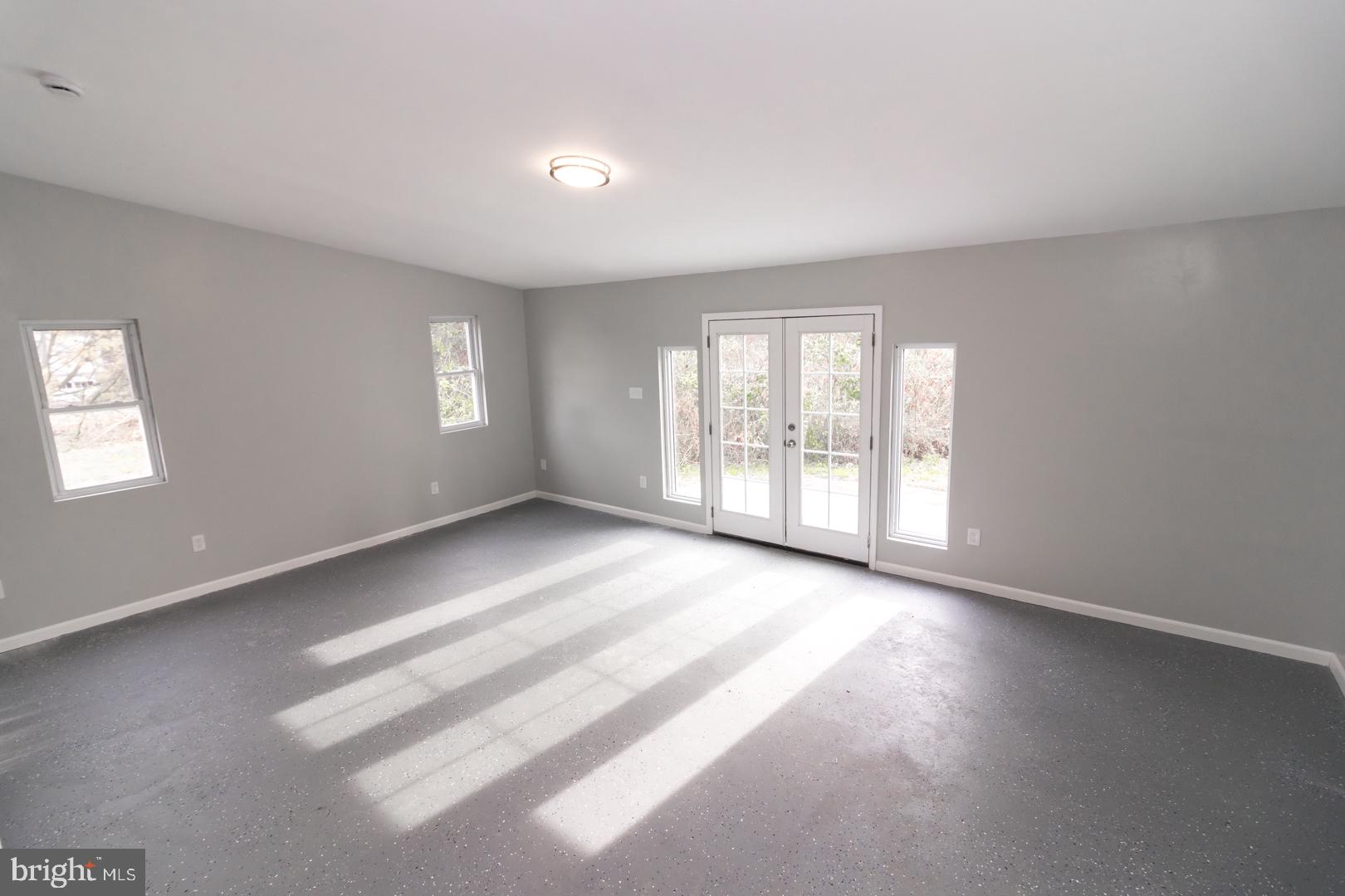 320 Fenwick Road Pilesgrove, NJ 08098 - Photo 4 of 18 a view of an empty room with a window