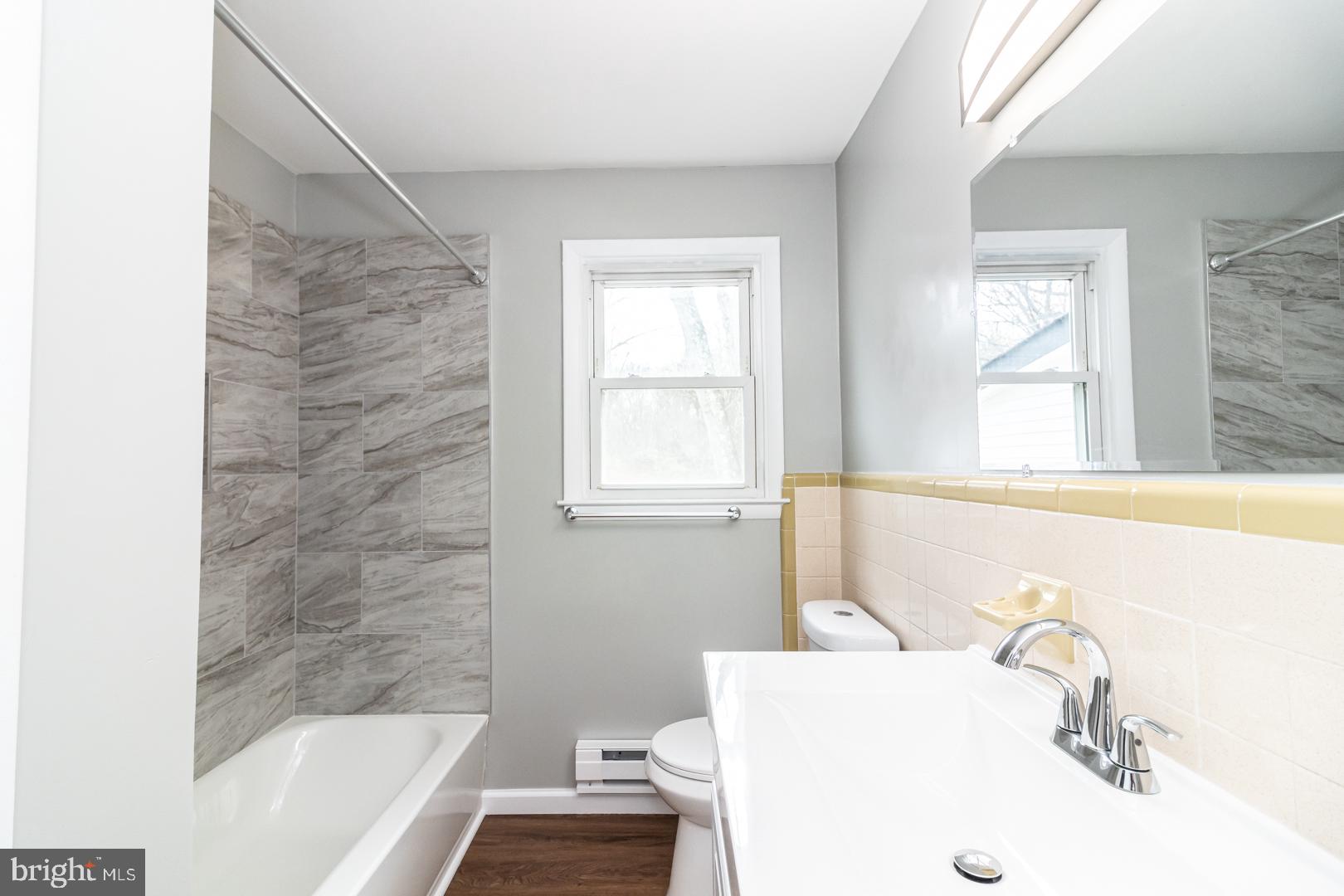 320 Fenwick Road Pilesgrove, NJ 08098 - Photo 9 of 18 a bathroom with a sink and a bathtub