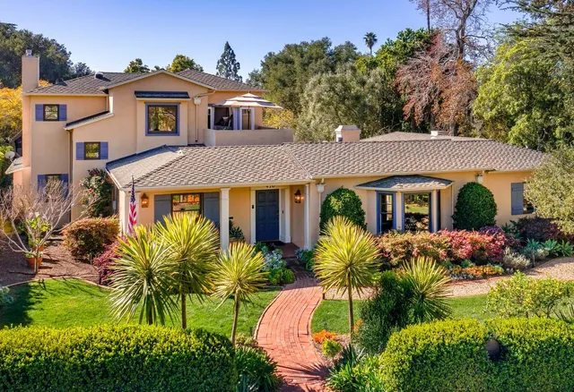 a front view of house with yard and green space