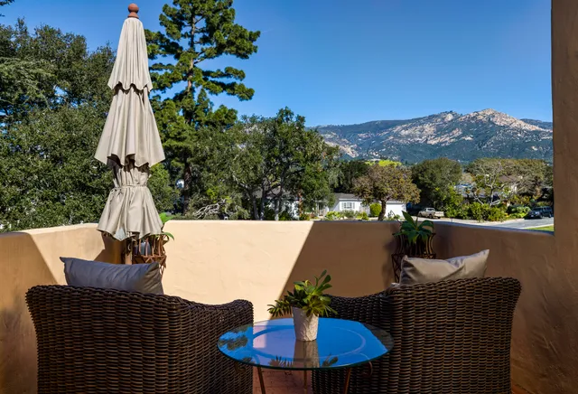 a terrace of a house with outdoor seating