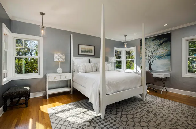 a bedroom with a bed and a table in it