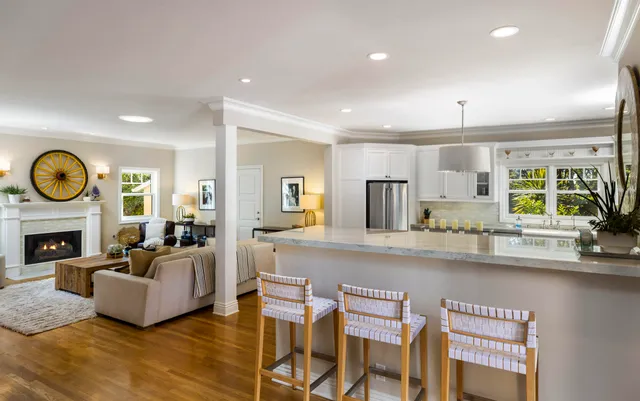 a living room with fireplace furniture and a fireplace