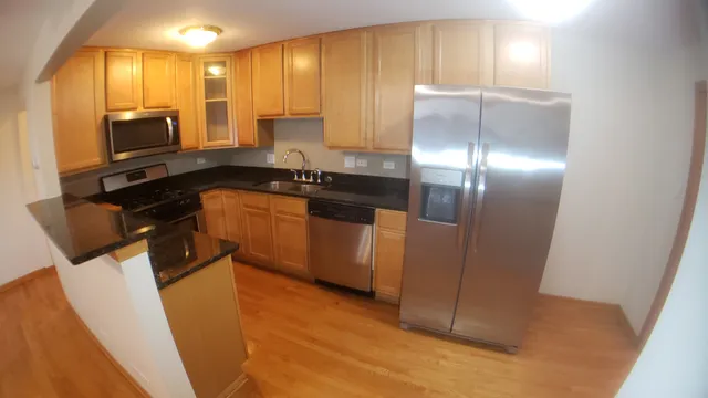 a kitchen with a stove and a refrigerator