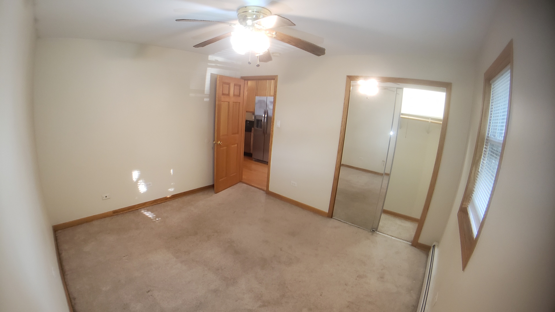 1124 Dunlop Avenue, Unit 2C Forest Park, IL 60130 - Photo 18 of 25 wooden floor in an empty room with a mirror