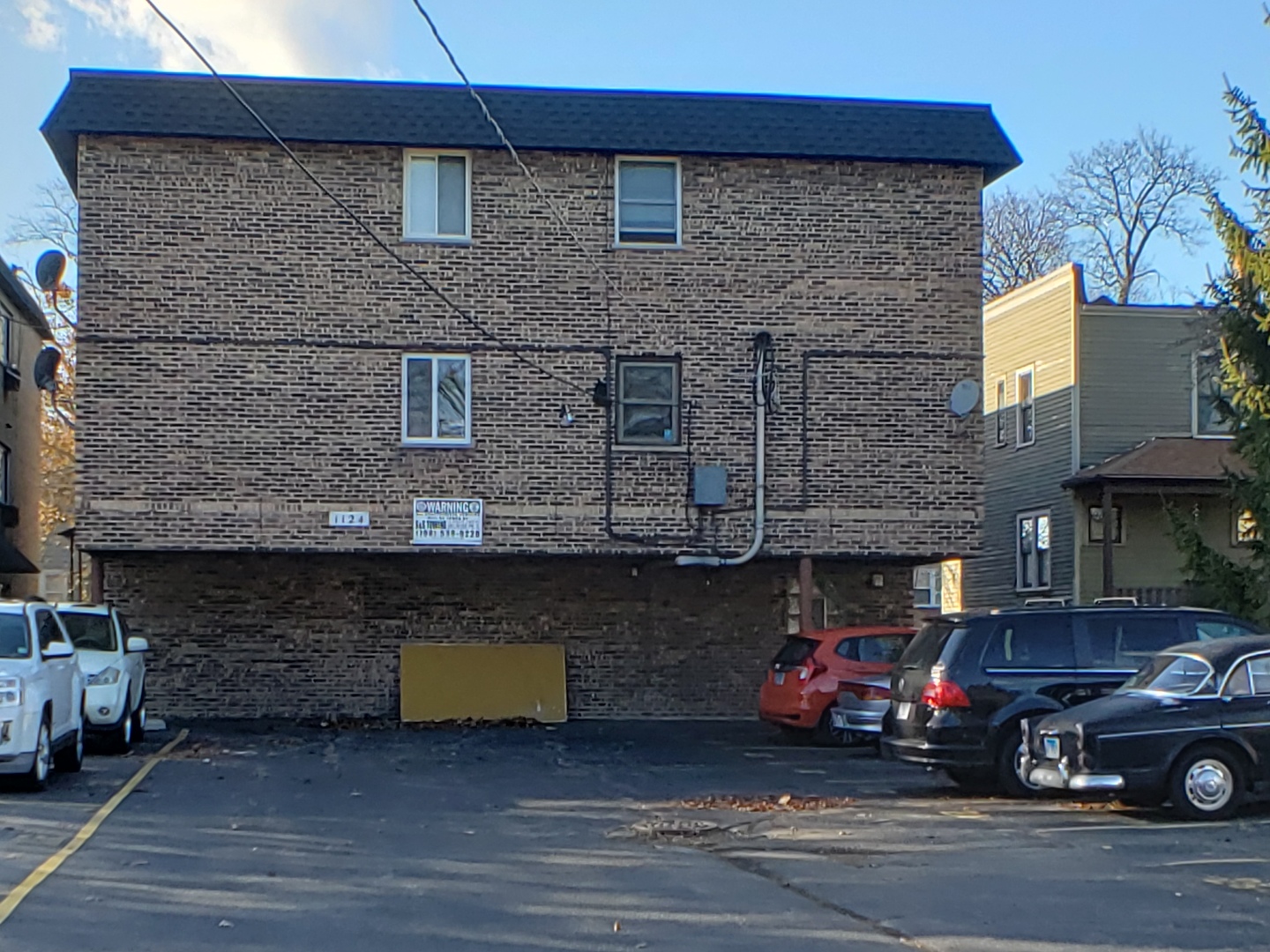 1124 Dunlop Avenue, Unit 2C Forest Park, IL 60130 - Photo 23 of 25 a view of a car parked in front of a building