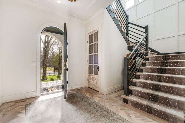 a view of entryway with wooden floor and window