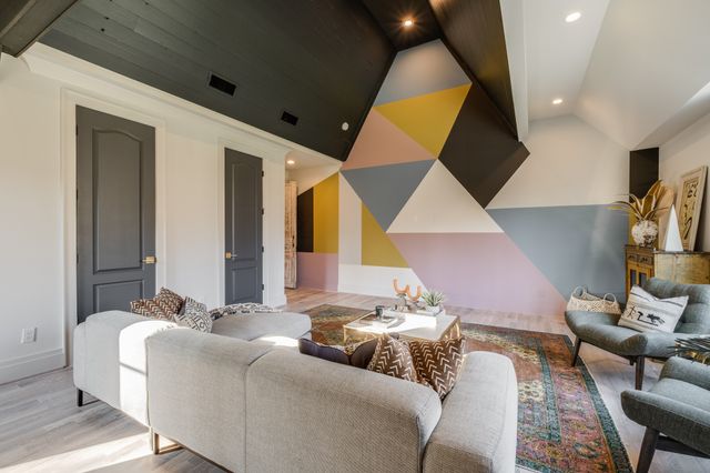 a bedroom with a bed a mirror and piano