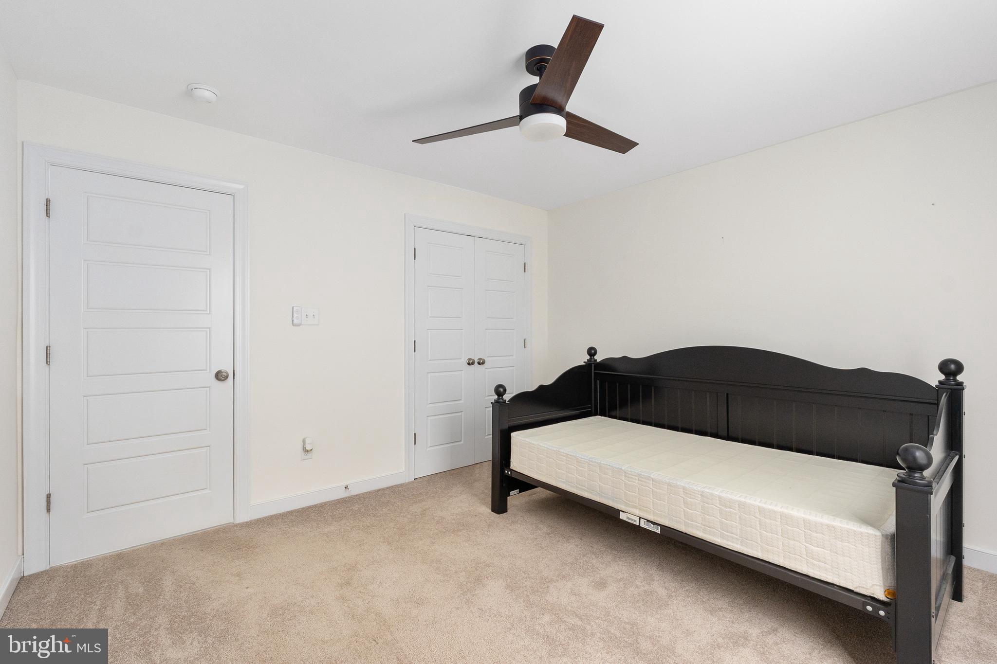 600 Signboard Road Bumpass, VA 23024 - Photo 31 of 49 a bedroom with a bed and a ceiling fan