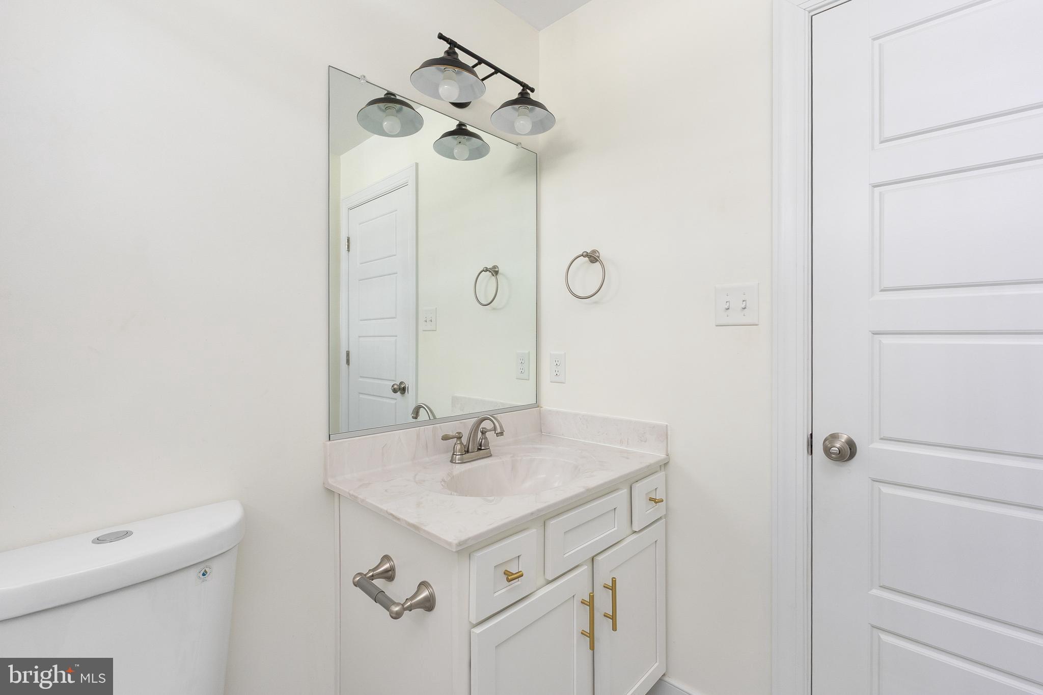600 Signboard Road Bumpass, VA 23024 - Photo 33 of 49 a bathroom with a sink a toilet and shower