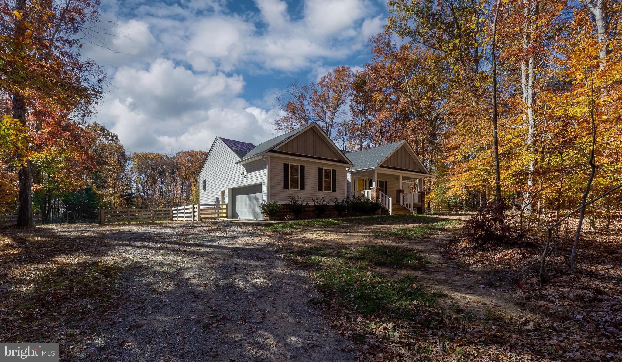 600 Signboard Road Bumpass, VA 23024 - Photo 5 of 49 a front view of a house with a yard