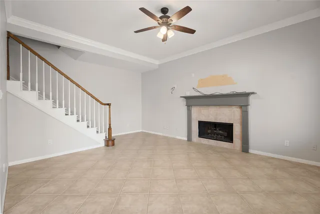 a view of an empty room with a fireplace