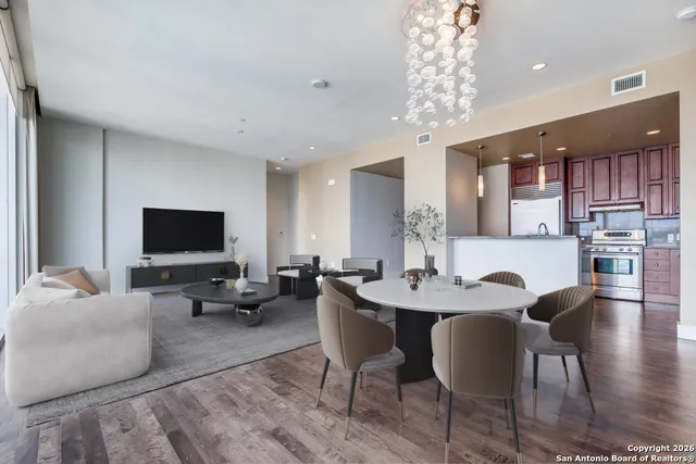 a view of a dining room with furniture window and wooden floor