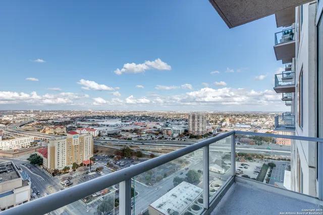 a view of a balcony with city view