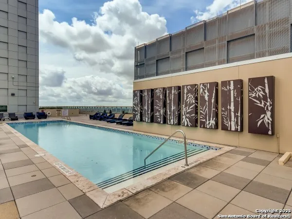 a view of a swimming pool with a chair