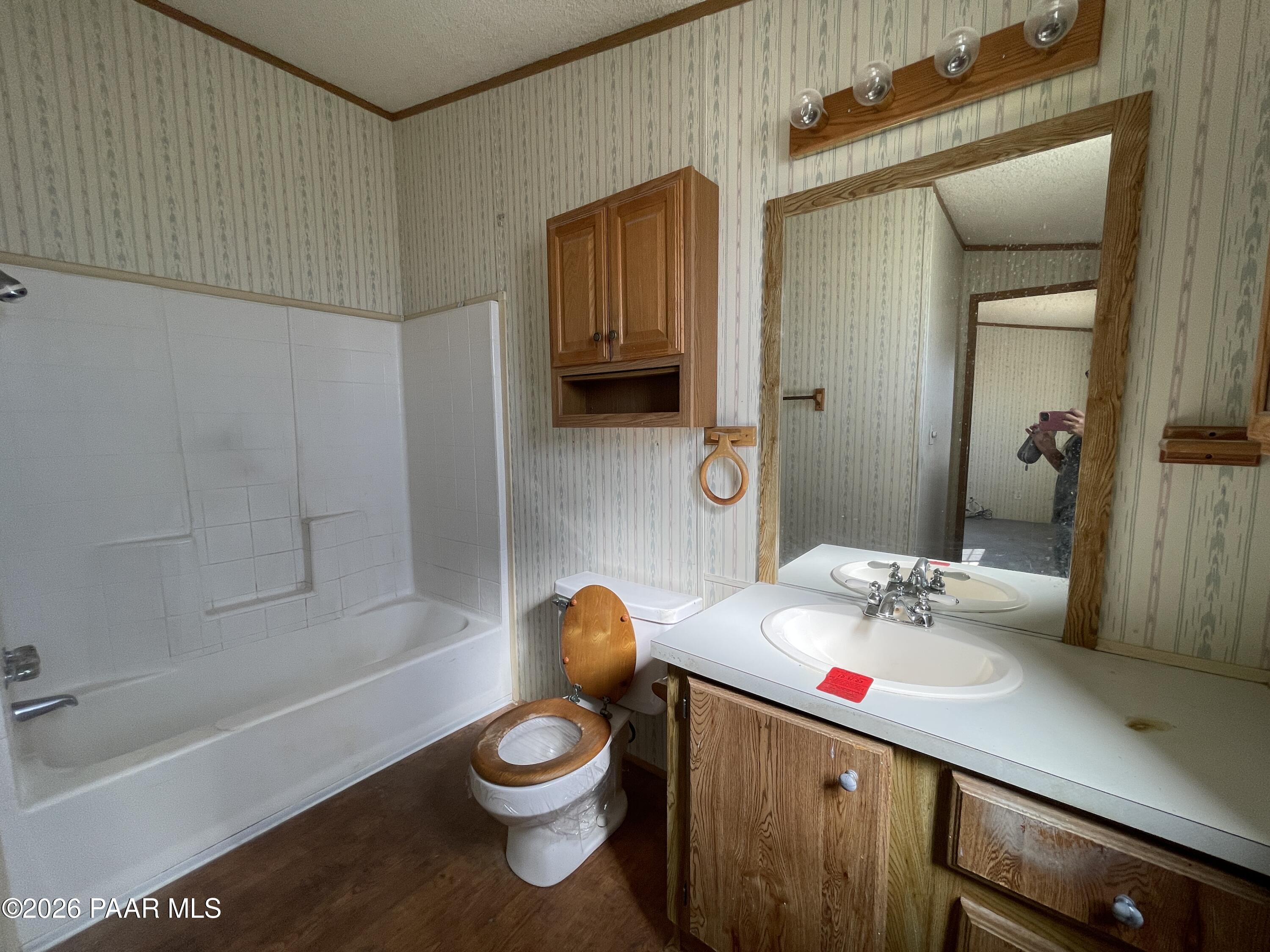 1355 South Reed Road Chino Valley, AZ 86323 - Photo 19 of 35 a bathroom with a sink toilet vanity and tub