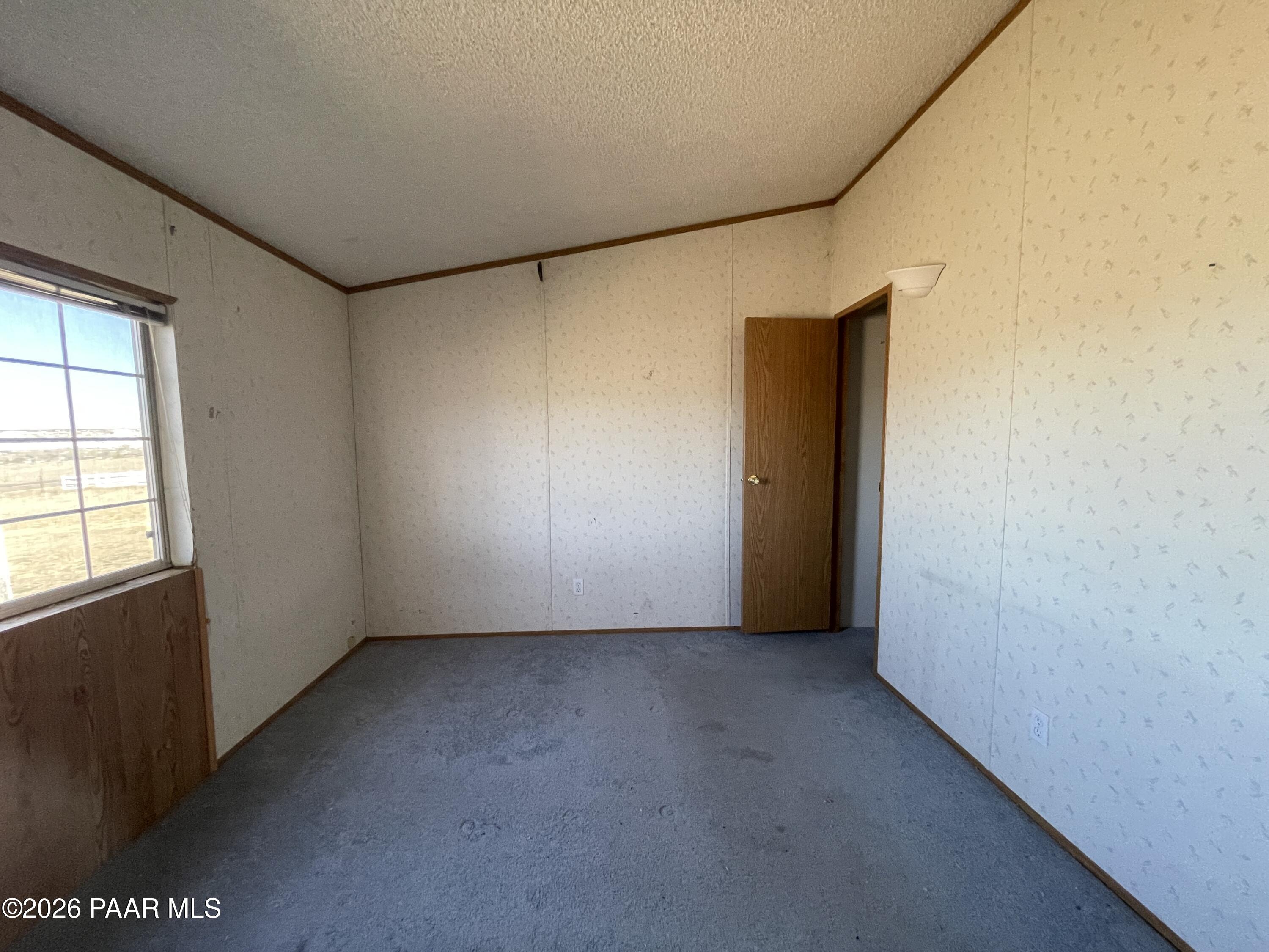 1355 South Reed Road Chino Valley, AZ 86323 - Photo 22 of 35 an empty room with windows
