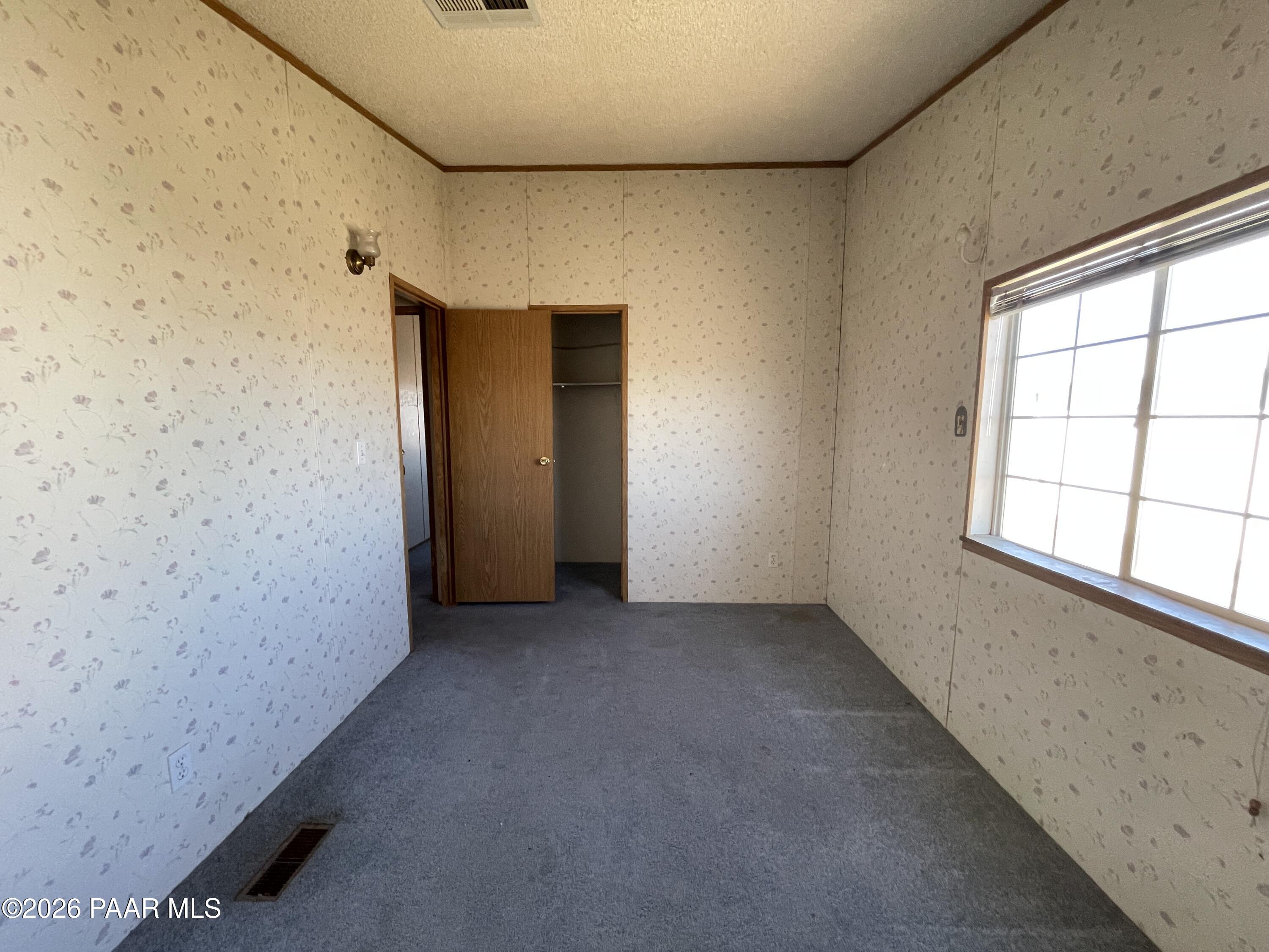 1355 South Reed Road Chino Valley, AZ 86323 - Photo 25 of 35 an empty room with windows
