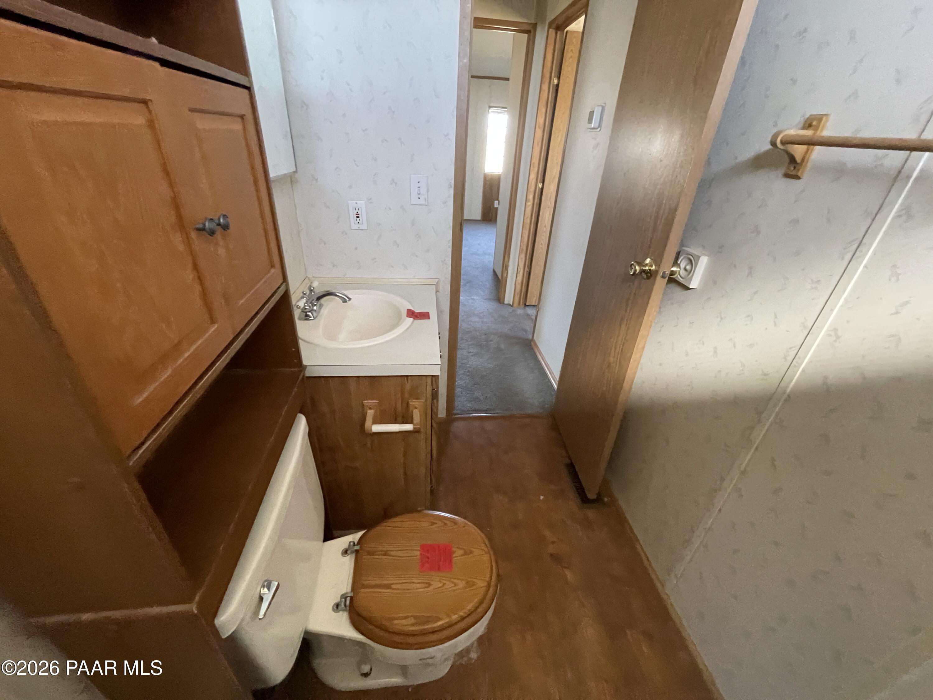 1355 South Reed Road Chino Valley, AZ 86323 - Photo 26 of 35 a bathroom with a sink and toilet