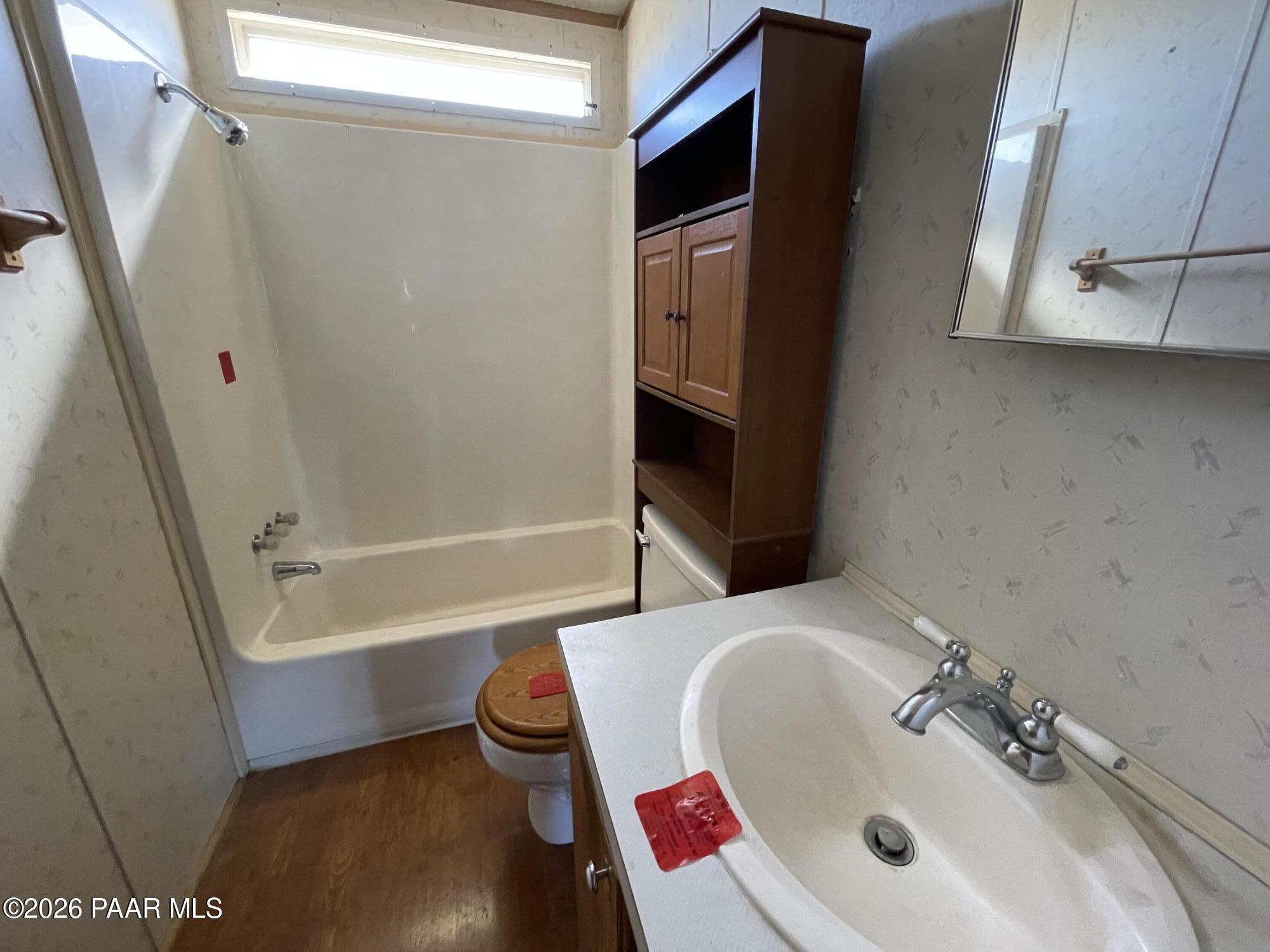 1355 South Reed Road Chino Valley, AZ 86323 - Photo 27 of 35 a bathroom with a sink and a bathtub