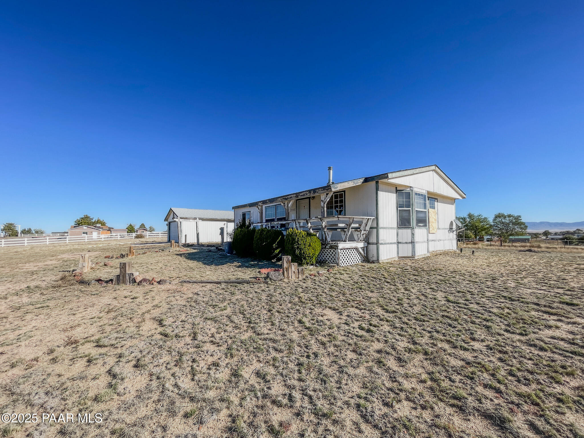 1355 South Reed Road Chino Valley, AZ 86323 - Photo 3 of 35 a view of a house with a road