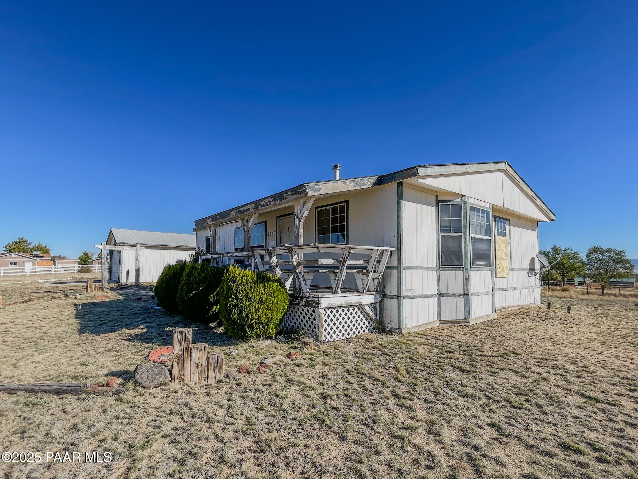 1355 South Reed Road Chino Valley, AZ 86323 - Photo 4 of 35 a front view of a house with a yard