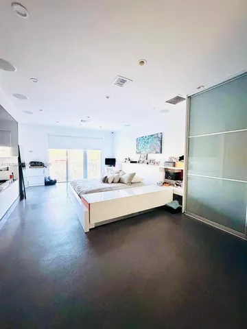 a view of an entryway with wooden floor