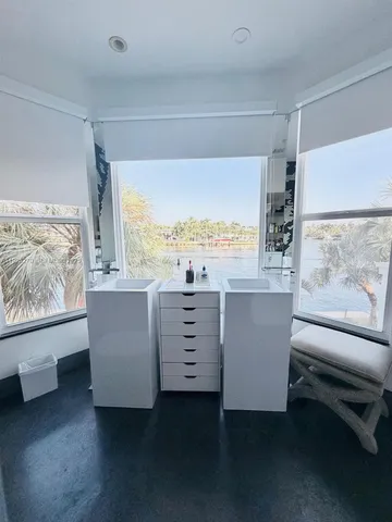 a view of a livingroom with an empty space and a window